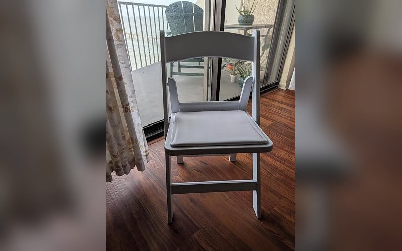 White padded resin folding chair, the upgrade option for weddings and receptions in Sheboygan County