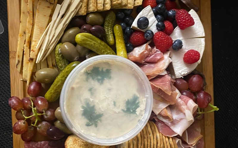Charcuterie board with salami, prosciutto, brie, berries, olives and crackers — serves 4 to 8
