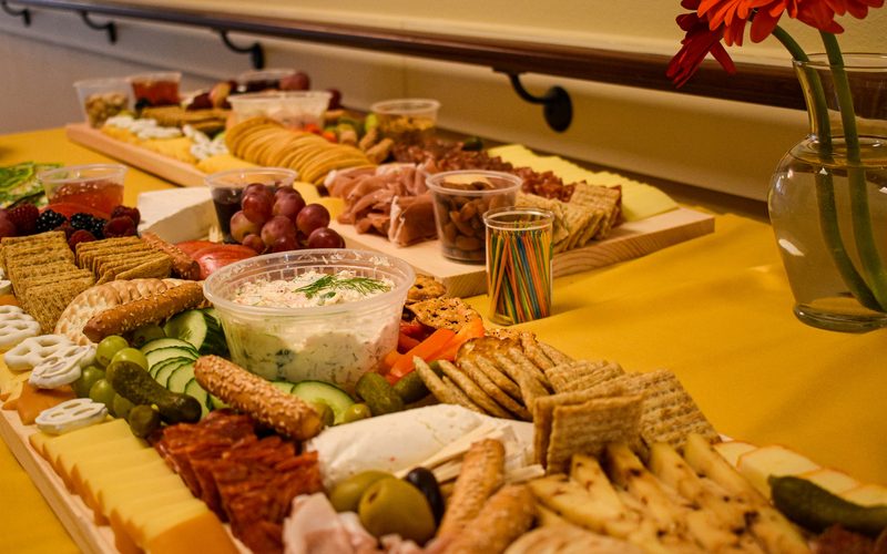 Two large charcuterie platters set up on a table for a social event in Sheboygan County